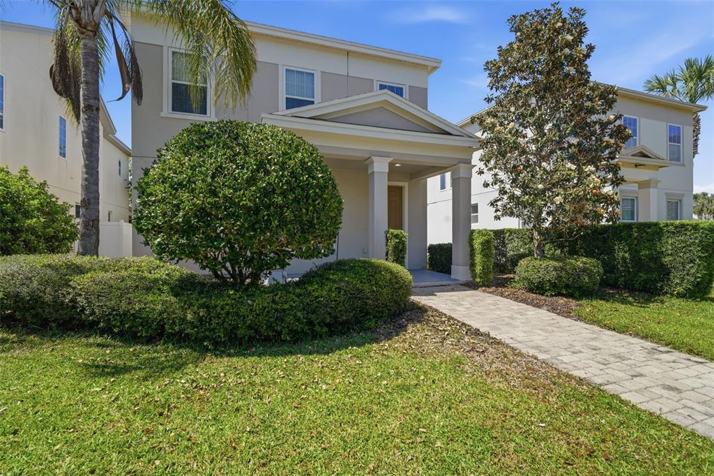 11486 Misty Oak Alley Windermere, FL 34786 - Photo 8 of 47 a front view of a house with a yard