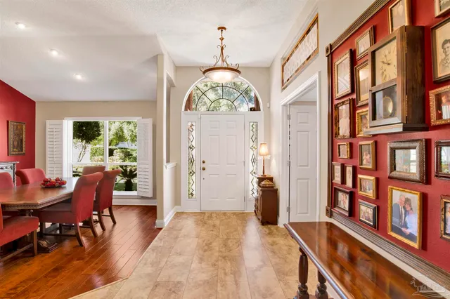 a view of a livingroom with furniture window and wooden floor