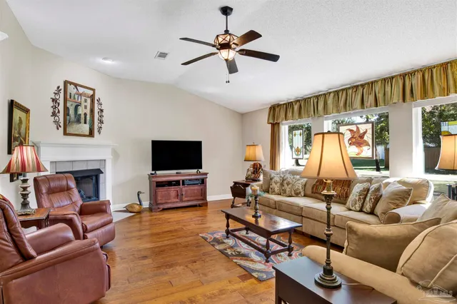 a living room with furniture and a flat screen tv
