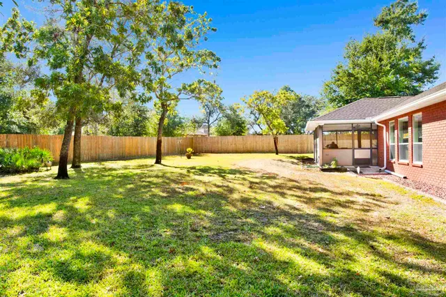 a house with swimming pool in front of it