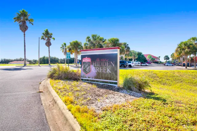 a view of swimming pool with a lounge chairs