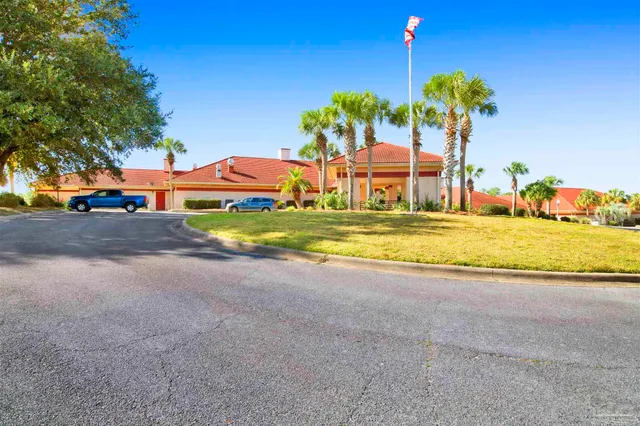 a view of a house with outdoor space and sitting area