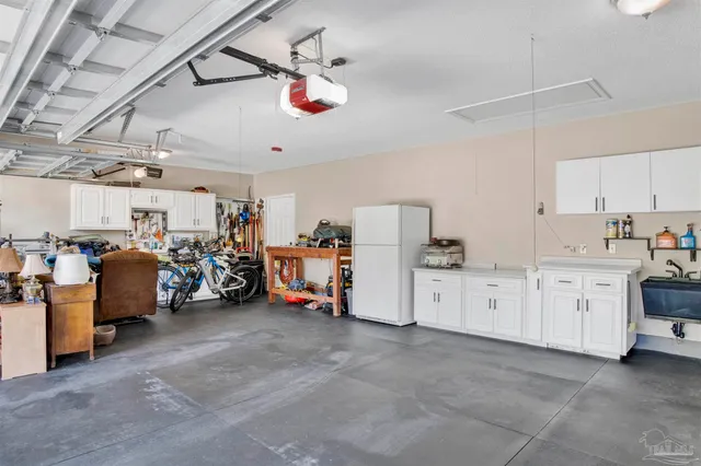 a storage room with cabinets and a stove