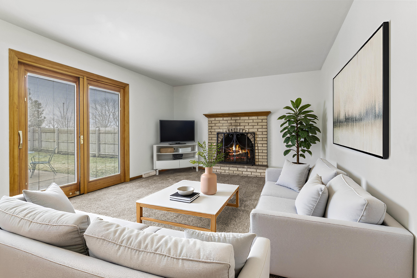7209 Grant Street Darien, IL 60561 - Photo 17 of 36 a living room with furniture flat screen tv and a fireplace