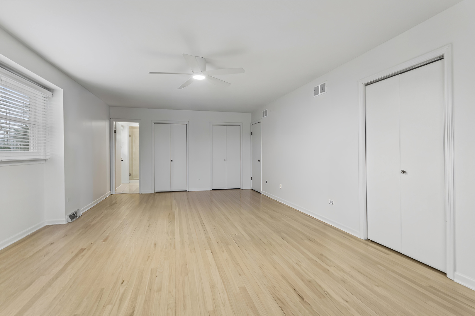 7209 Grant Street Darien, IL 60561 - Photo 23 of 36 a view of a room with wooden floor and window