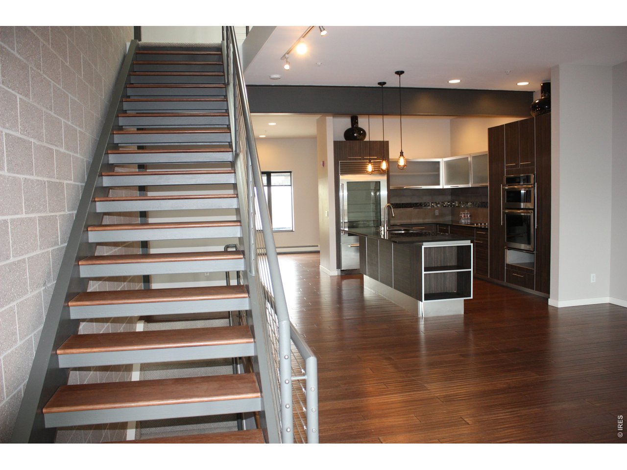11562 Colony Row Broomfield, CO 80021 - Photo 10 of 24 Stairs going up to 2nd Floor/Kitchen