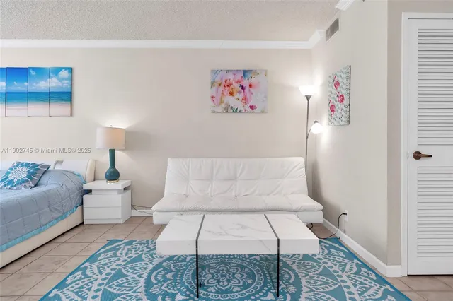 a living room with furniture and a rug