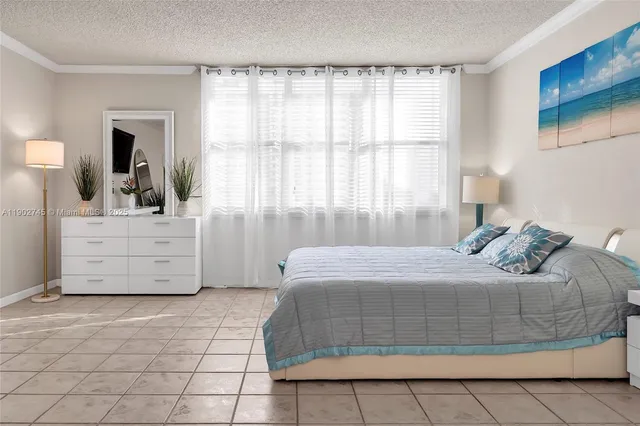 a bedroom with a bed and a mirror