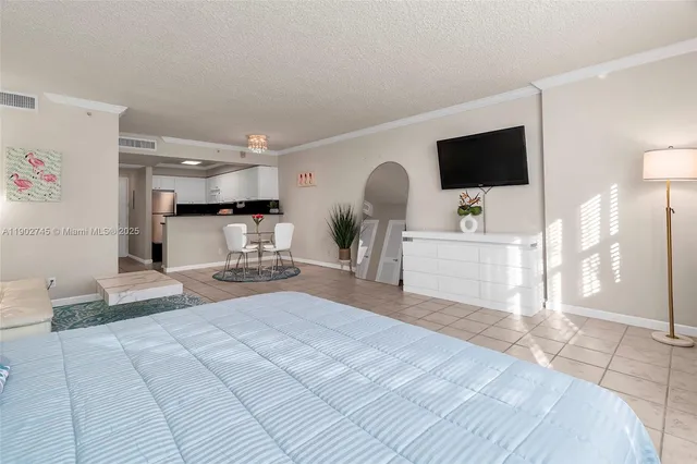 a view of a livingroom with furniture and a flat screen tv