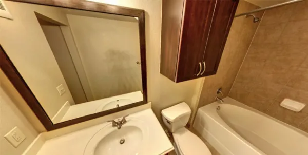 a bathroom with a tub and a sink