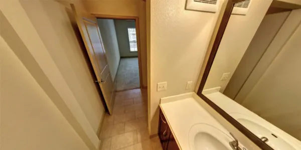 a view of a bathroom with tub and door