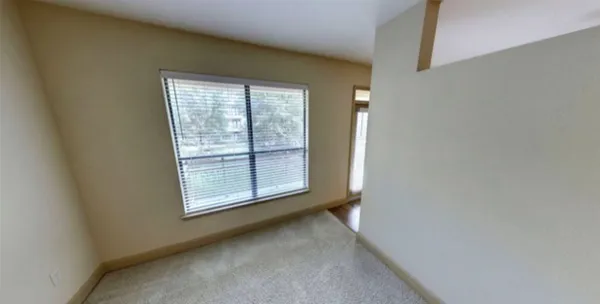 a view of a room that has a window in it