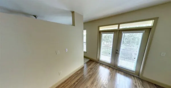 a view of hallway with wooden floor