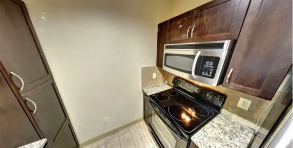 a view of an oven and wooden floor
