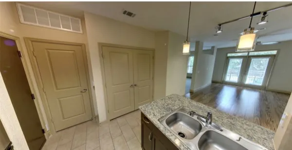 a view of a kitchen cabinets and a wooden floor