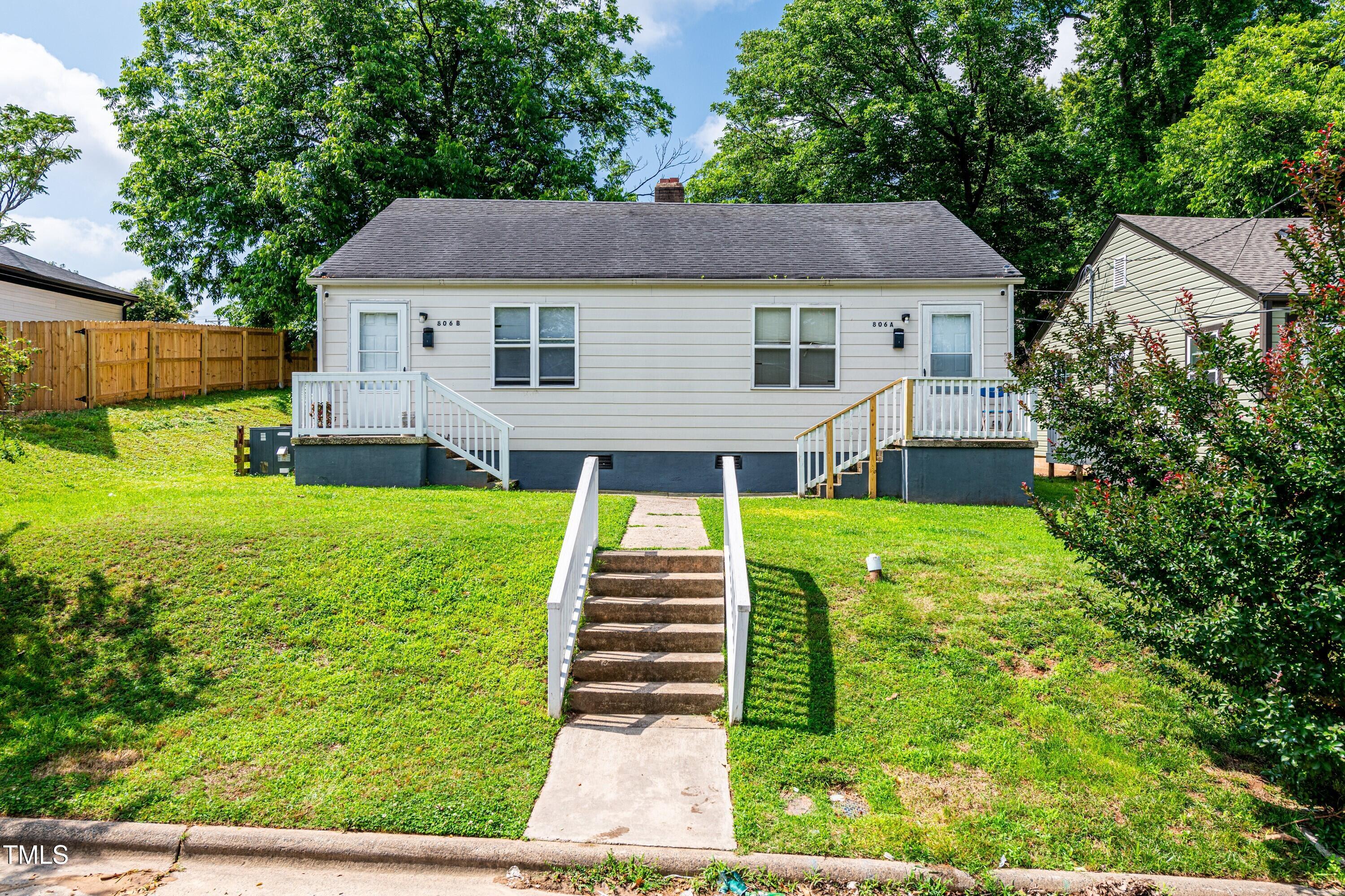 a aerial view of a house with a yard