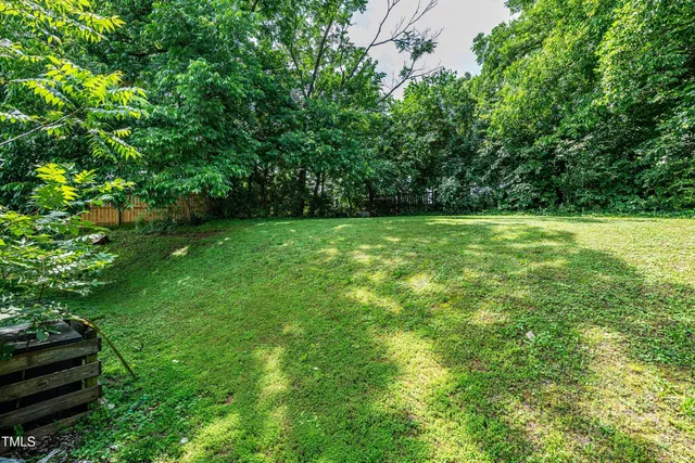a view of outdoor space with deck and yard