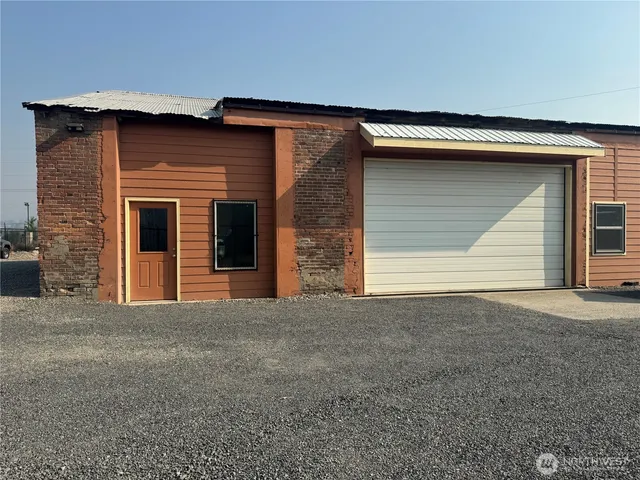 a front view of a house with a garage