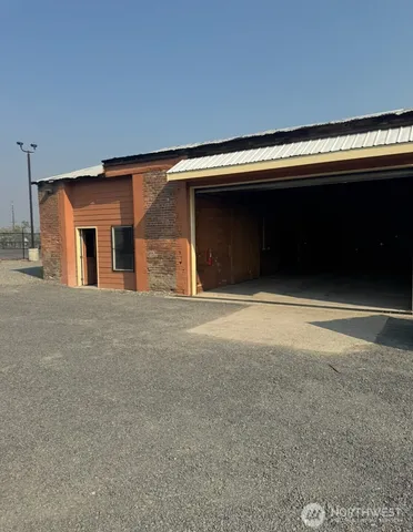 a view of empty room with a fireplace