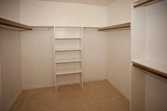 a view of an empty walk in closet