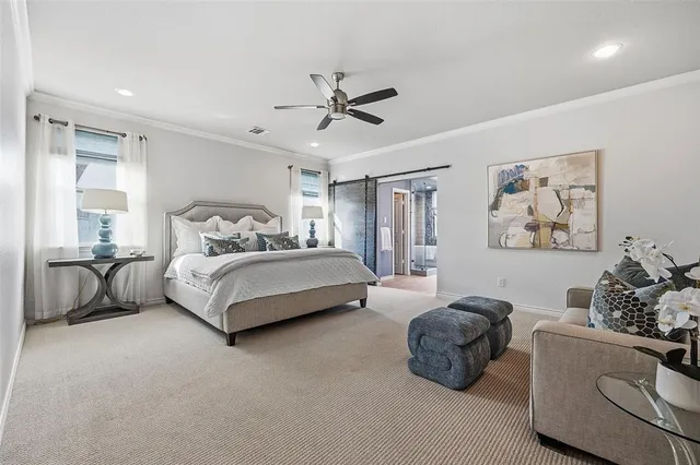 a bedroom with a bed and ceiling fan