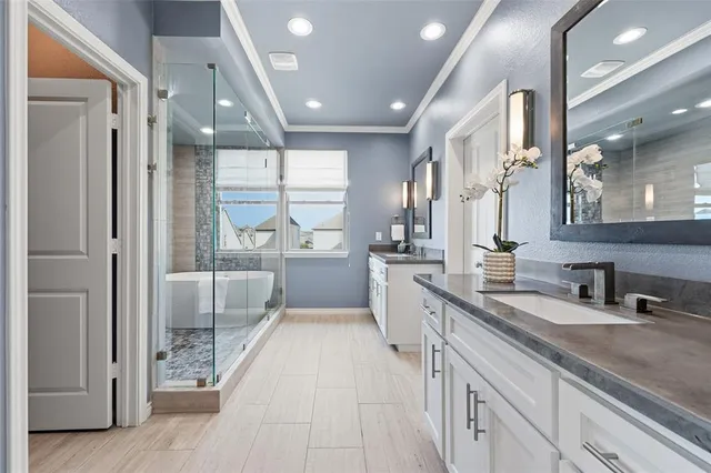 a bathroom with a granite countertop sink a mirror and vanity