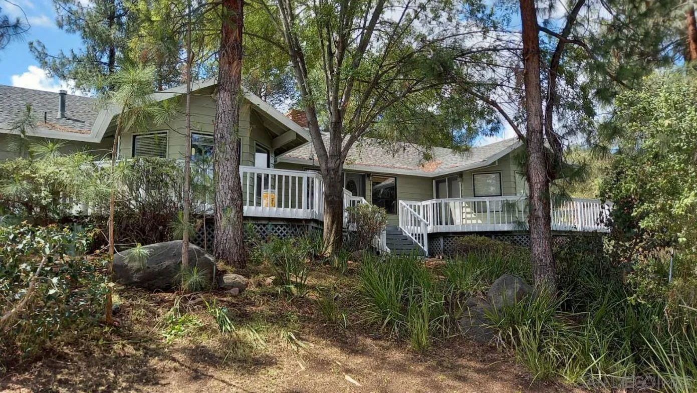 625 South Grade Road Alpine, CA 91901 - Photo 1 of 42 a view of a house with a yard and large trees