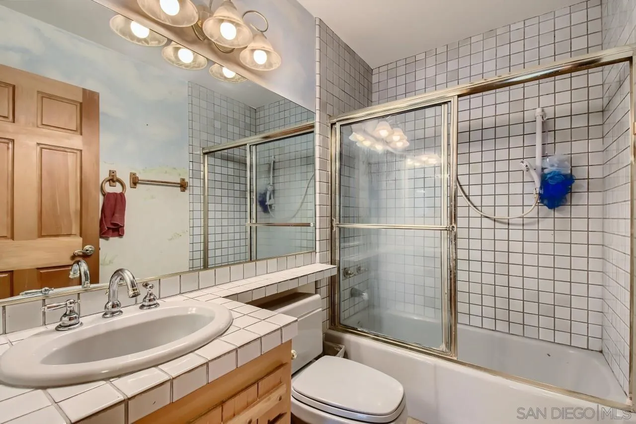 625 South Grade Road Alpine, CA 91901 - Photo 21 of 42 a bathroom with a sink vanity granite toilet and shower