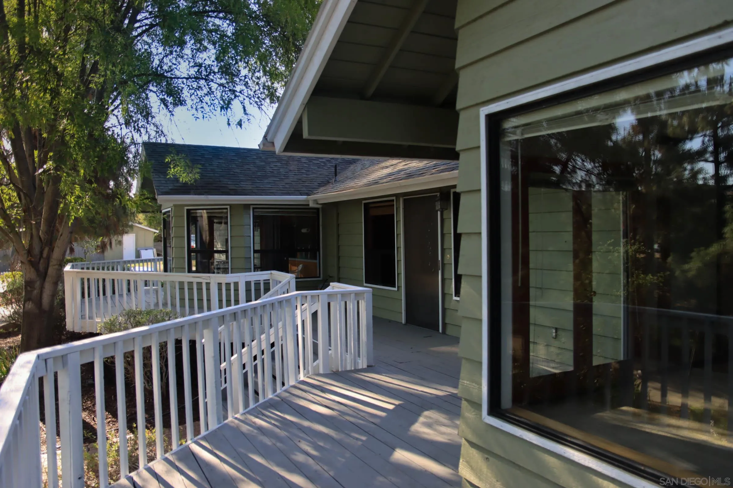 625 South Grade Road Alpine, CA 91901 - Photo 28 of 42 a view of a porch with a floor to ceiling window and wooden floor