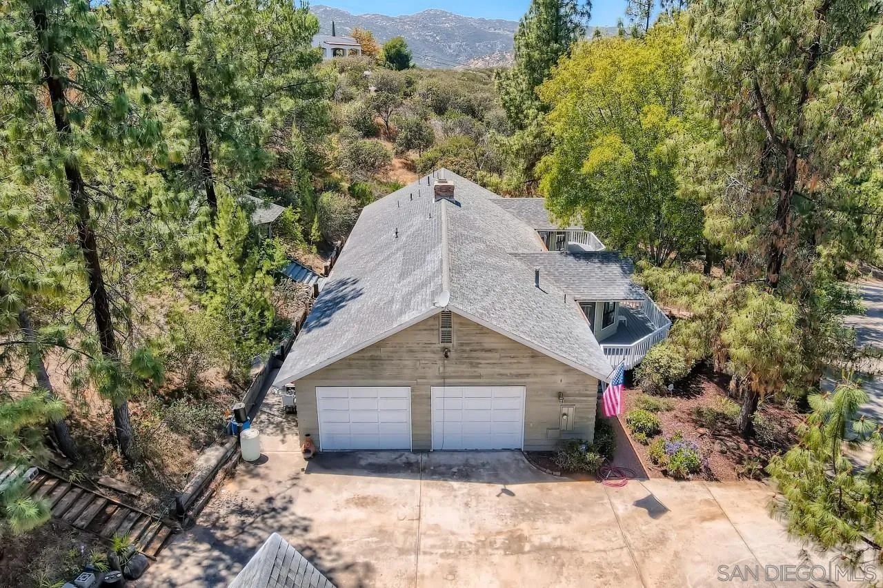 625 South Grade Road Alpine, CA 91901 - Photo 31 of 42 a view of a house with a yard and large trees