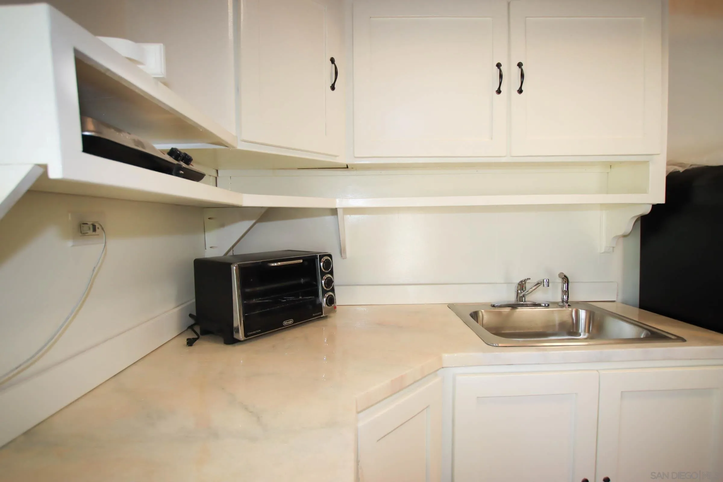 625 South Grade Road Alpine, CA 91901 - Photo 42 of 42 a kitchen with a sink and cabinets