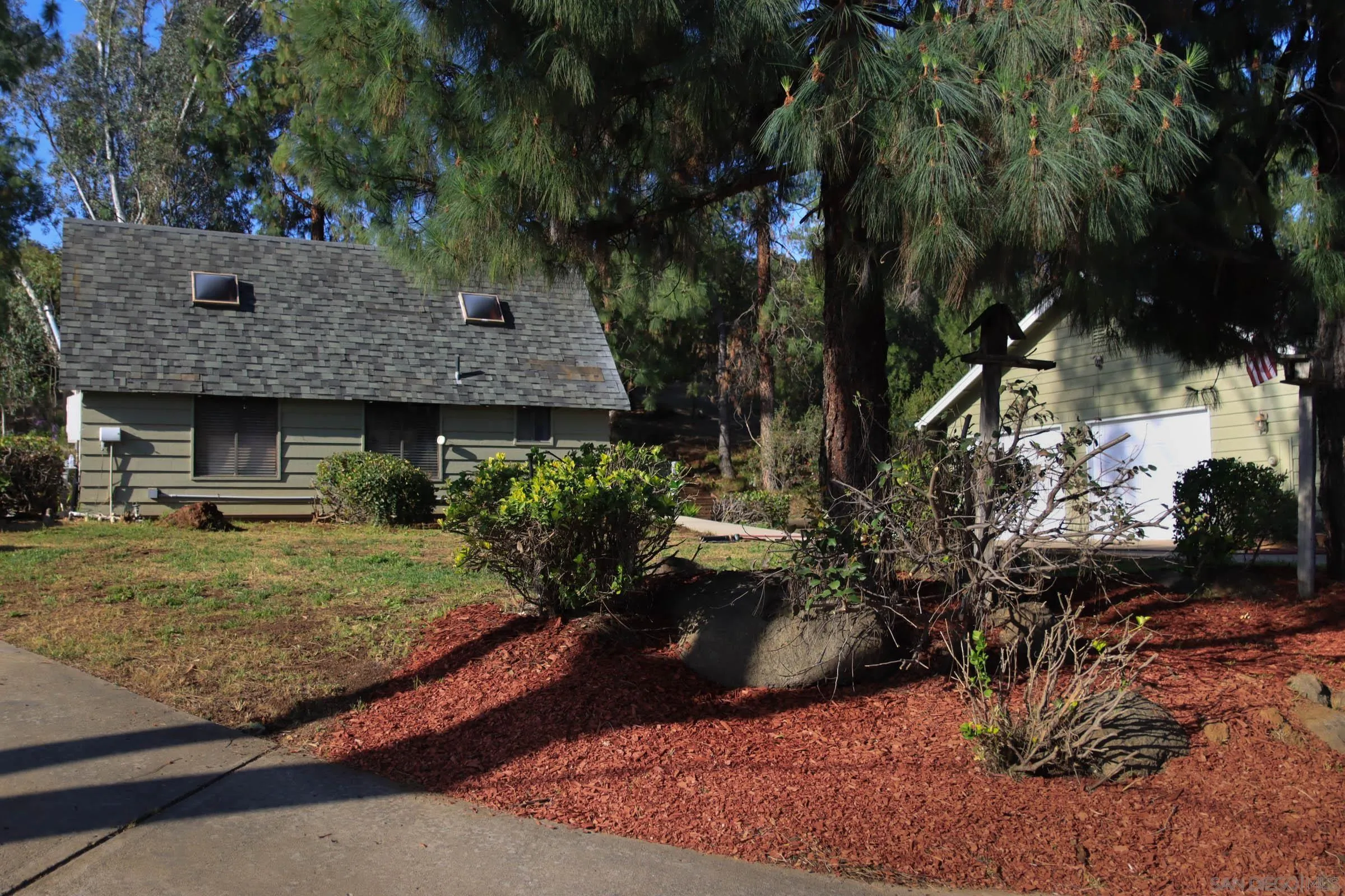625 South Grade Road Alpine, CA 91901 - Photo 5 of 42 a view of a couches and a fire pit in the backyard of the house