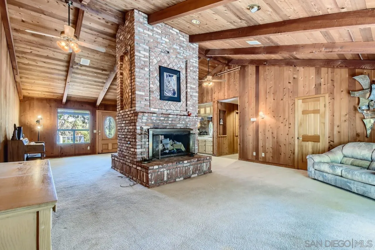 625 South Grade Road Alpine, CA 91901 - Photo 8 of 42 a living room with furniture and a fireplace