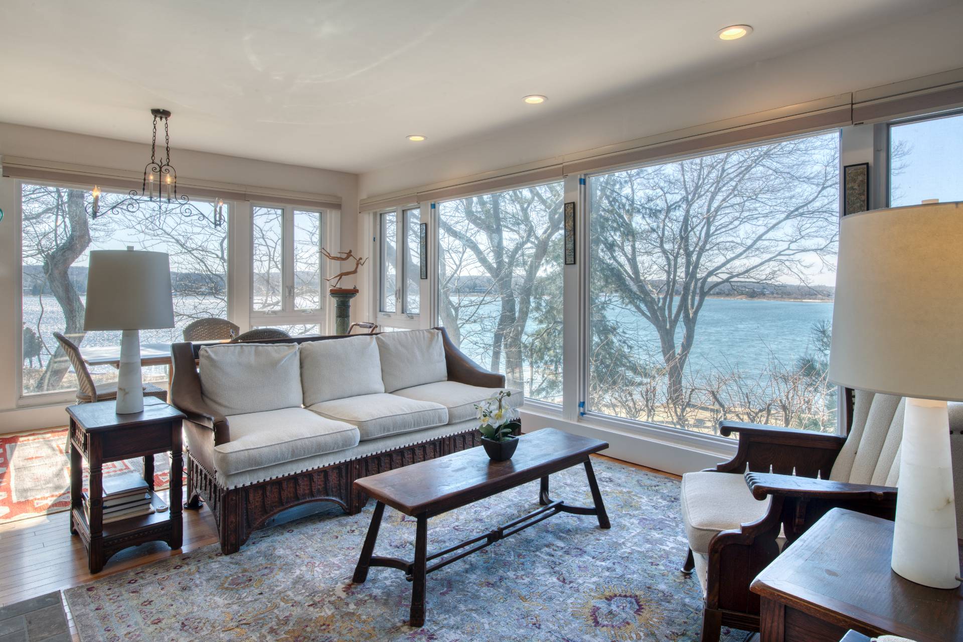 140 Redwood Road Sag Harbor, NY 11963 - Photo 2 of 14 a living room with furniture and a lamp
