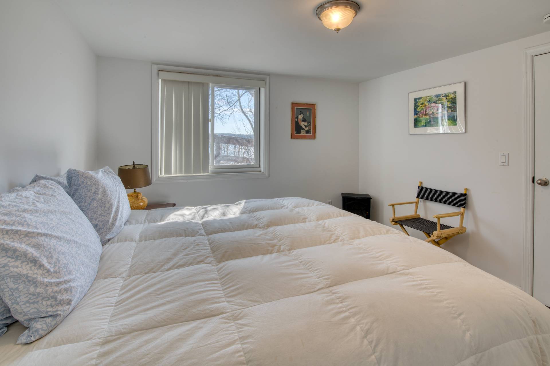 140 Redwood Road Sag Harbor, NY 11963 - Photo 9 of 14 a bedroom with a bed and window