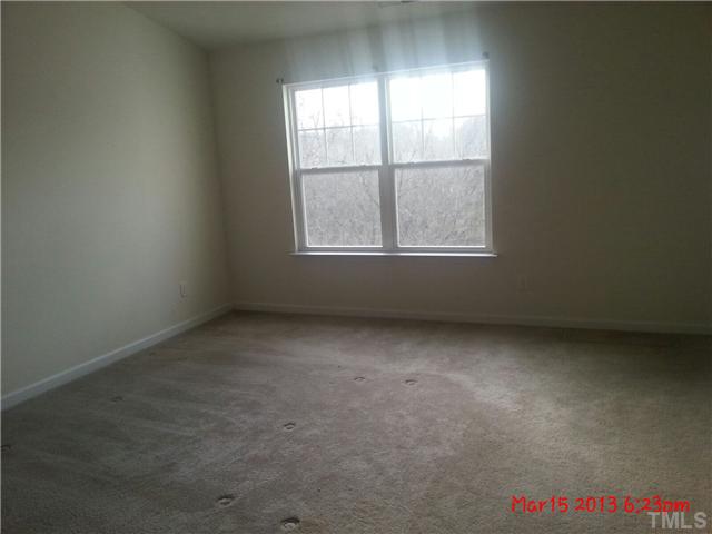 14411 Hamletville Street Raleigh, NC 27614 - Photo 6 of 16 an empty room with a window