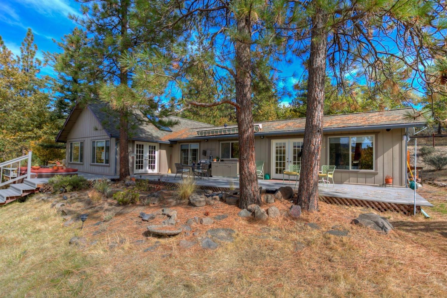 8009 Dead Indian Memorial Road Ashland, OR 97520 - Photo 7 of 24 a front view of a house with a yard and porch