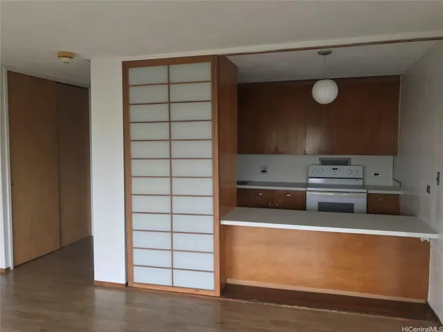 a kitchen with a stove and a microwave