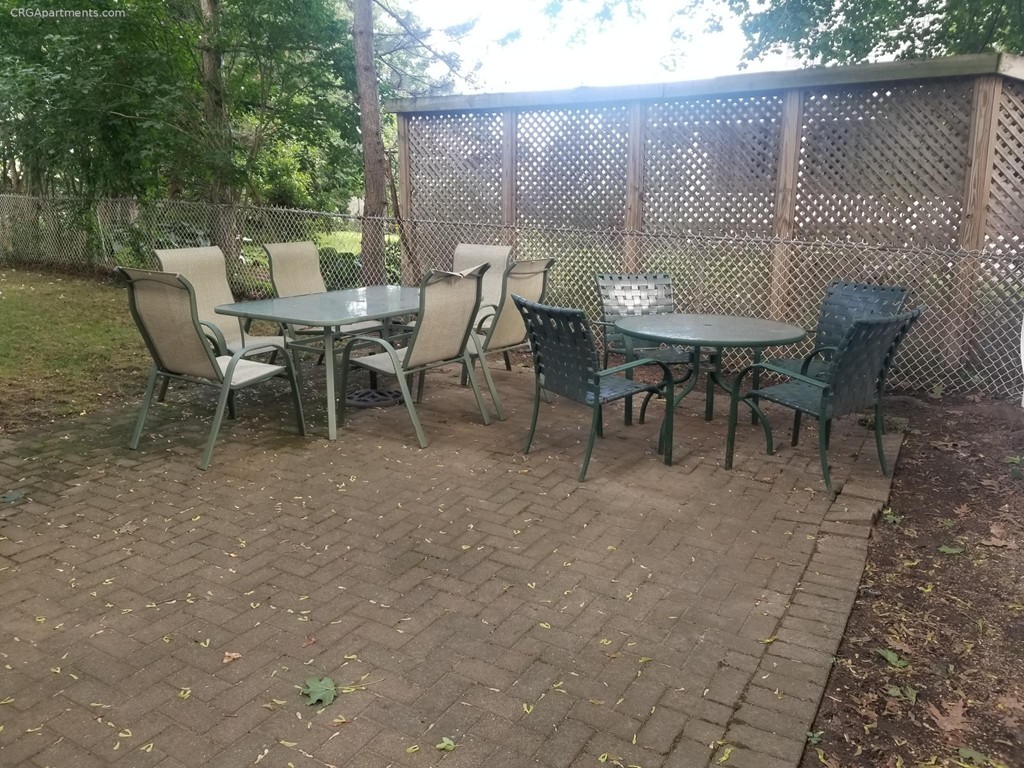50 Marion Road, Unit 1 Arlington, MA 02474 - Photo 8 of 8 a view of a outdoor space with a table and chairs
