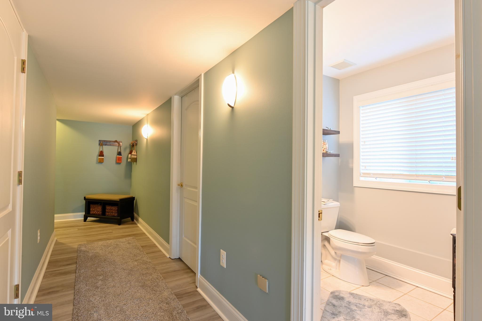 3617 Branhum Road Edgewater, MD 21037 - Photo 33 of 55 Lower level hallway leads to garage & storage