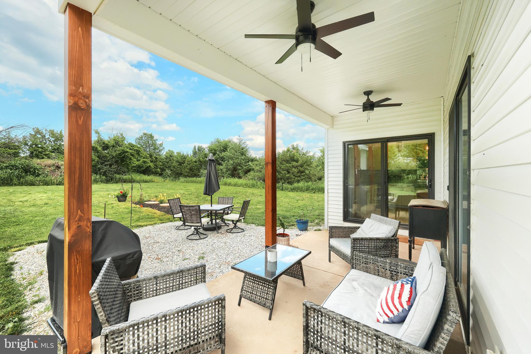 4575 Lewisberry Road York, PA 17404 - Photo 13 of 56 a living room with patio furniture and a floor to ceiling window
