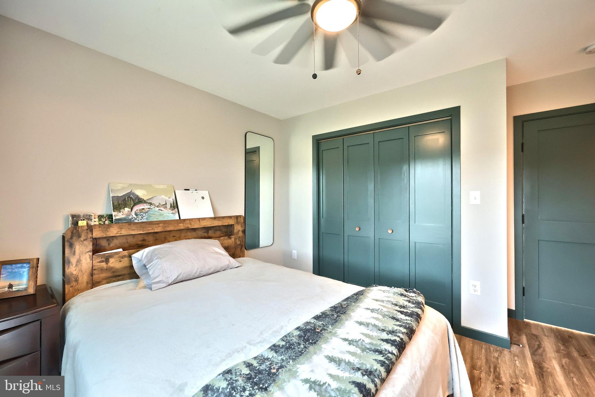 4575 Lewisberry Road York, PA 17404 - Photo 34 of 56 a bedroom with a bed and a chandelier