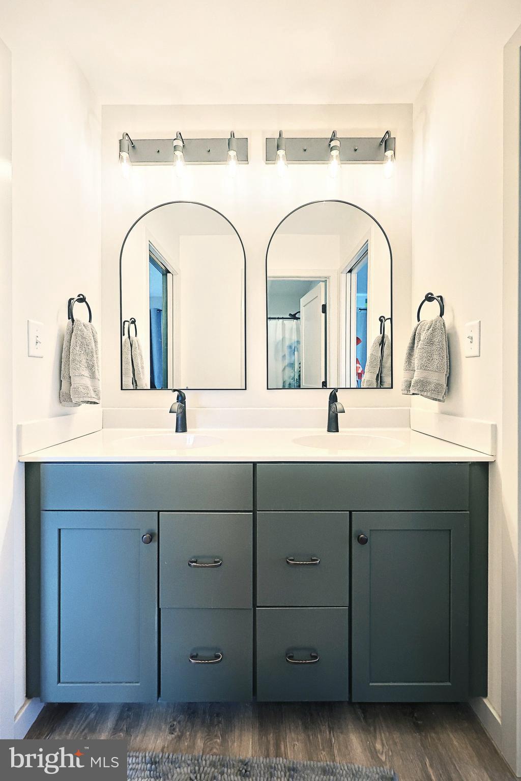 4575 Lewisberry Road York, PA 17404 - Photo 36 of 56 a bathroom with a double vanity sink and a mirror