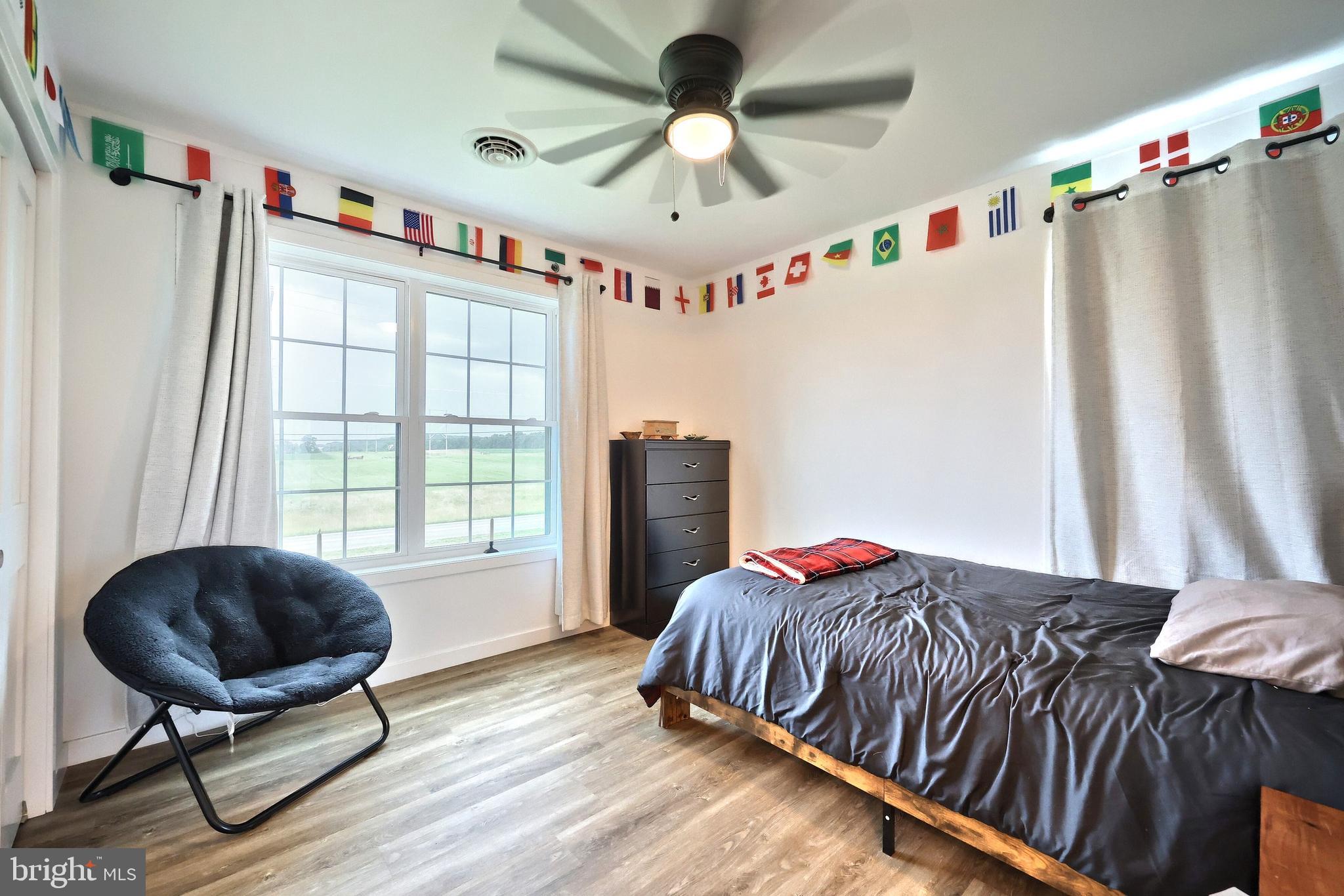 4575 Lewisberry Road York, PA 17404 - Photo 38 of 56 a bedroom with a bed and a chandelier
