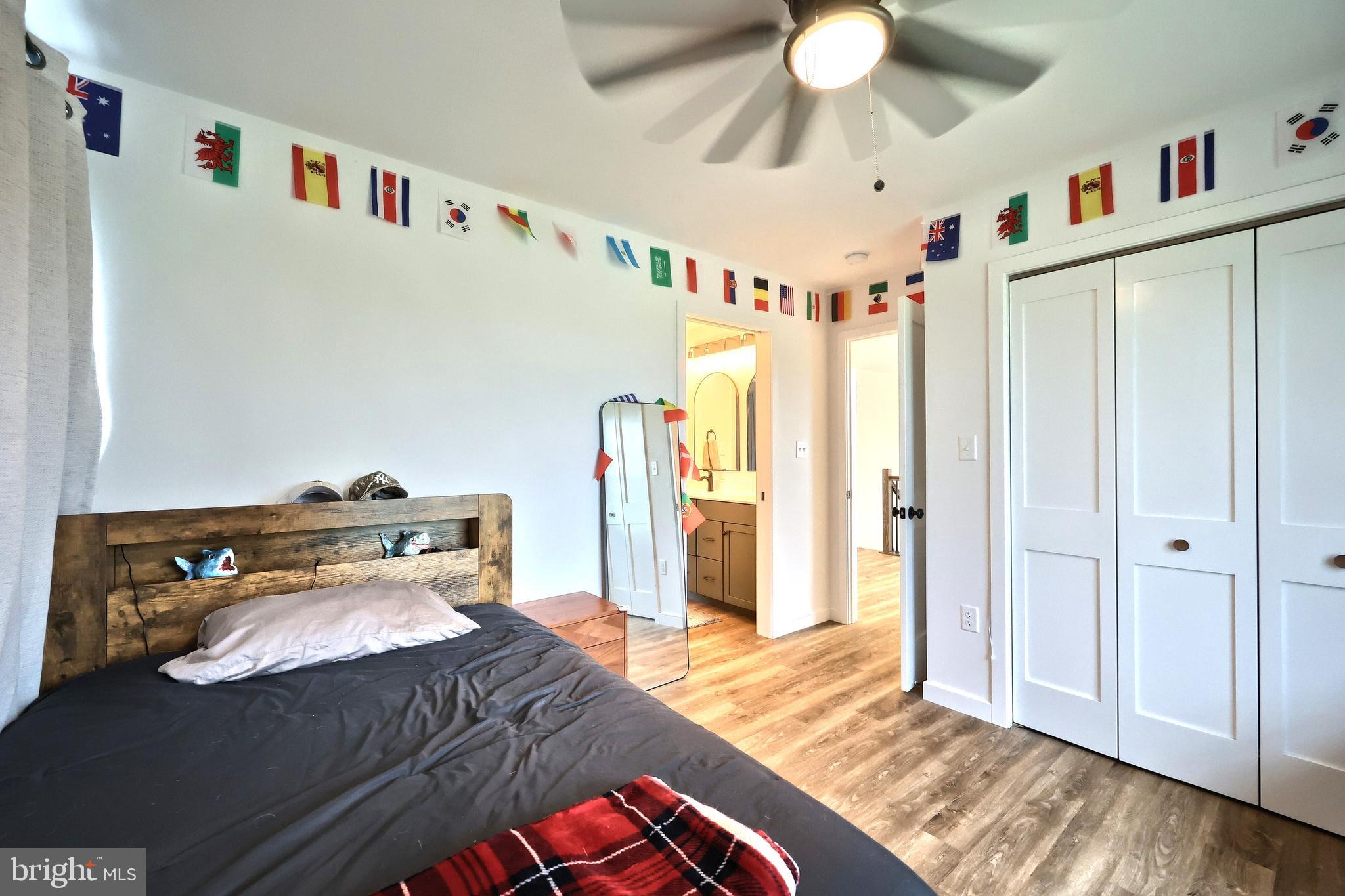 4575 Lewisberry Road York, PA 17404 - Photo 39 of 56 a bedroom with a bed and a chandelier