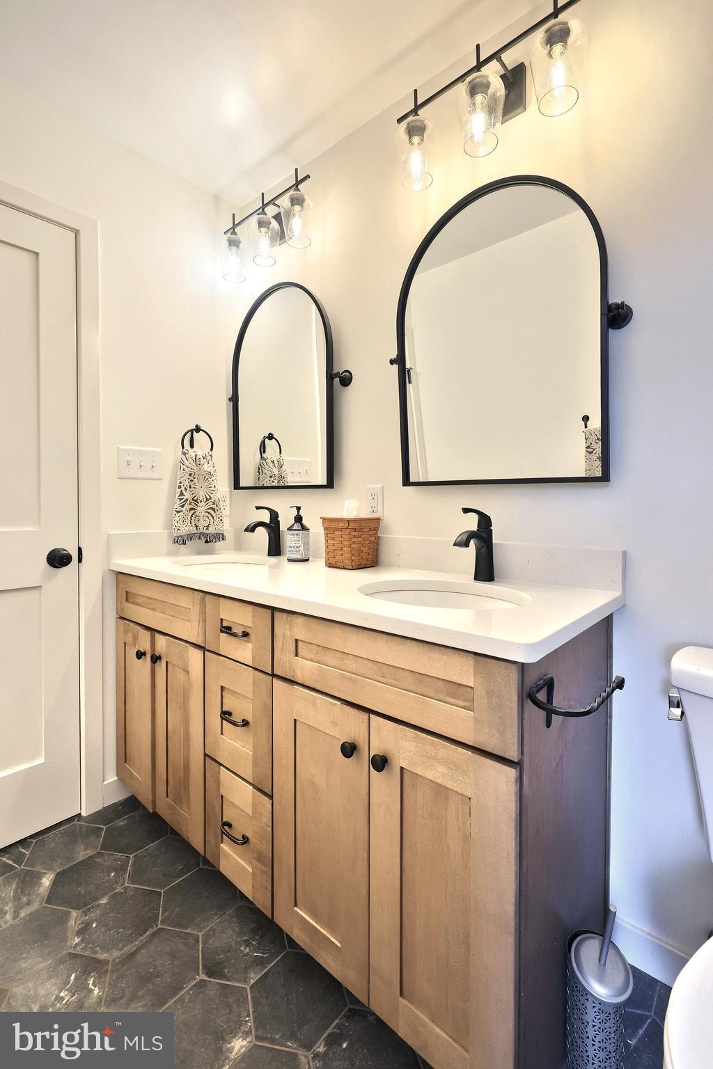 4575 Lewisberry Road York, PA 17404 - Photo 42 of 56 a bathroom with a sink and a mirror