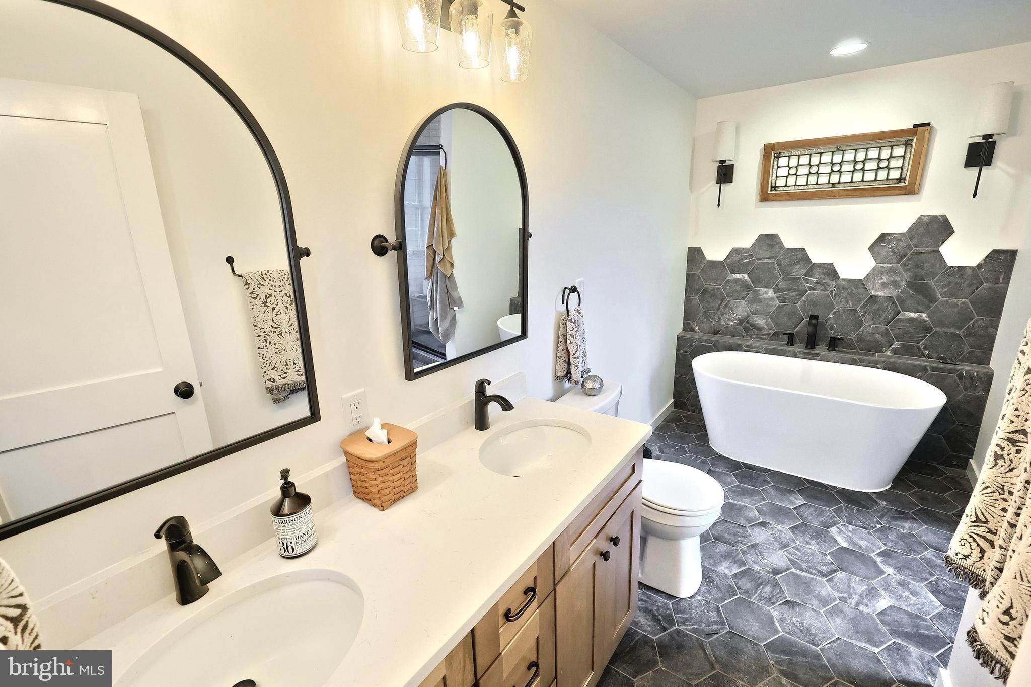 4575 Lewisberry Road York, PA 17404 - Photo 43 of 56 a bathroom with a sink and a mirror
