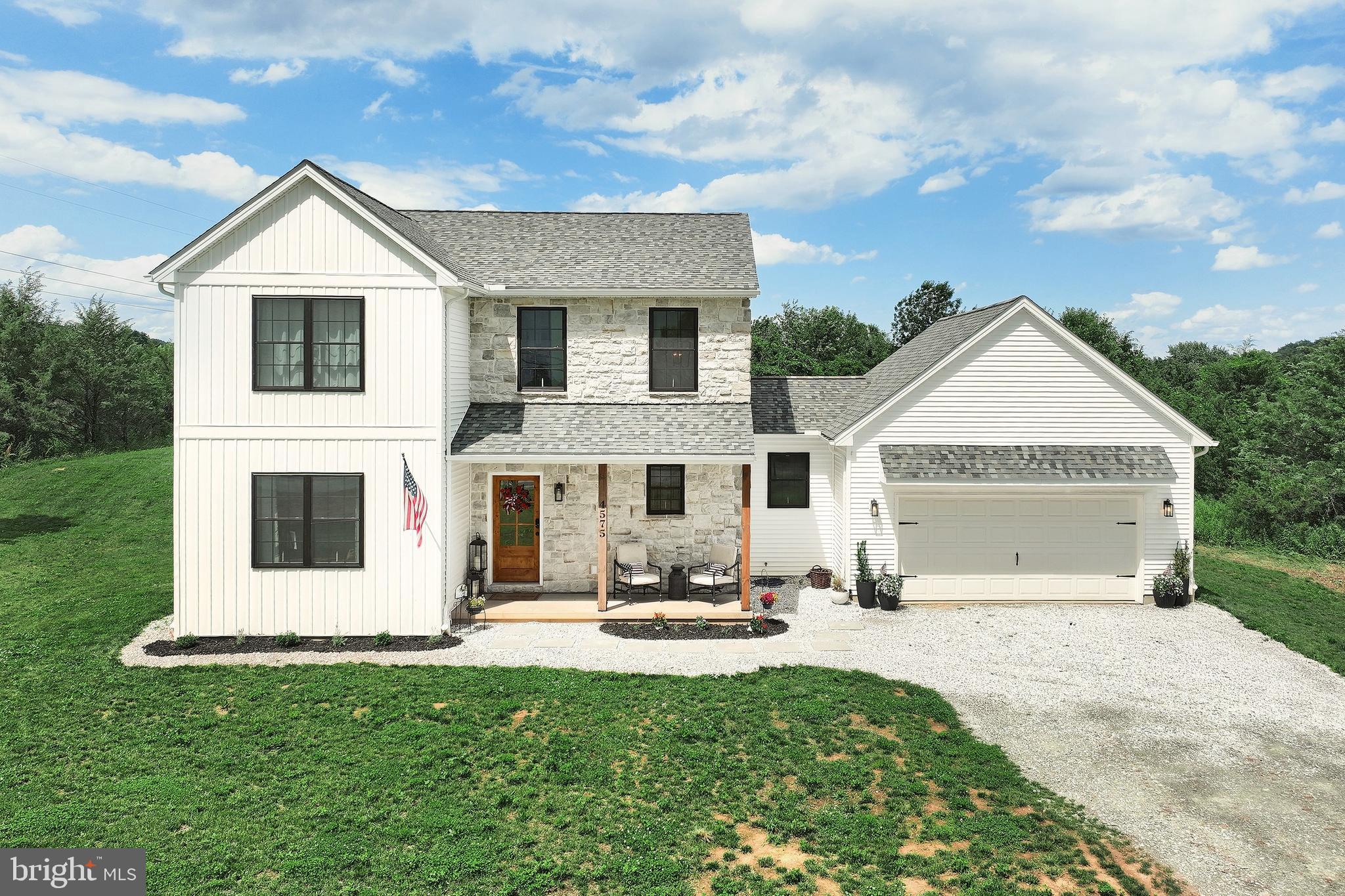 4575 Lewisberry Road York, PA 17404 - Photo 5 of 56 a view of a white house with a big yard and large trees