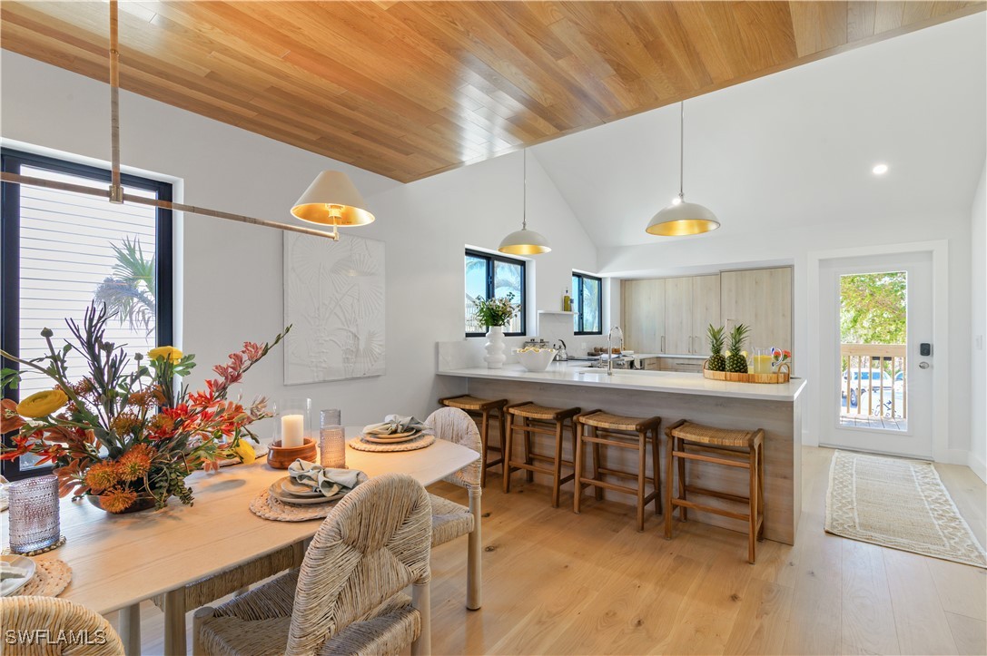 1411 Beach Cottages, Unit 1411 Captiva, FL 33924 - Photo 11 of 40 a dining room with furniture and window