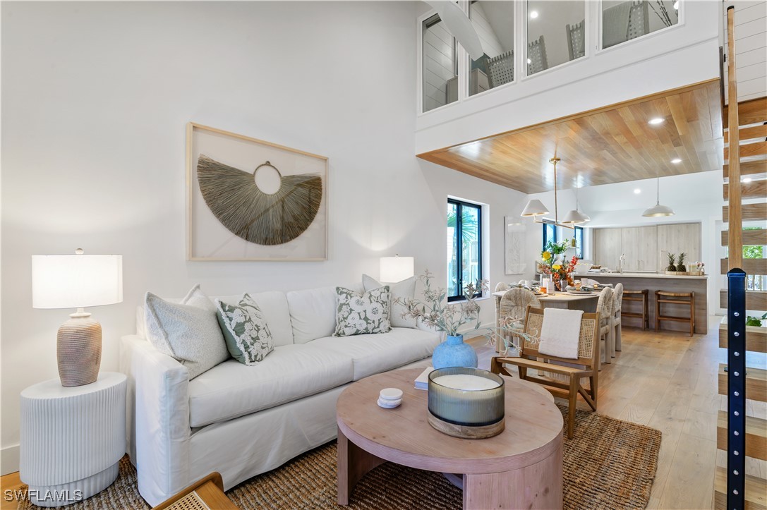 1411 Beach Cottages, Unit 1411 Captiva, FL 33924 - Photo 14 of 40 a living room with furniture and a table